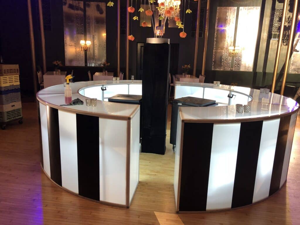 12ft round LED bar with brand graphics at a corporate event